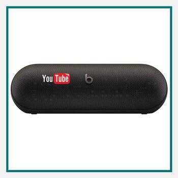 Beats by Dr. Dre Pill Bluetooth Speaker in matte black placed on a table with volume and power buttons visible