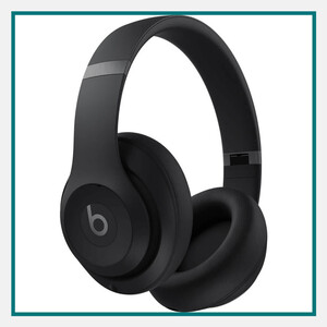 Black Beats over-ear wireless headphones with cushioned ear cups, padded headband, and matte finish, shown against a white background with a teal border.