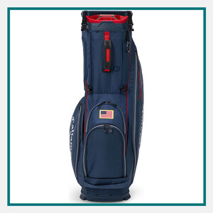 Blue Callaway golf cart bag with red accents, multiple zipper compartments, and an American flag patch, shown against a white background with a teal border.