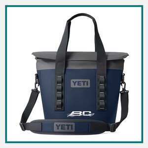 Blue and gray YETI tote cooler bag with black handles, shoulder strap, and custom logo placement, featured among the best luxury corporate gifts for executives.