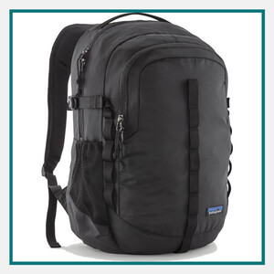 Patagonia 26L Refugio Backpack in black with padded shoulder straps, multiple zippered compartments, side mesh pocket, and Patagonia logo.