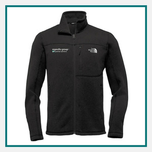 The North Face Men's Sweater Fleece Jacket in black with a full-zip front, stand collar, zippered chest pocket, and embroidered Expedia Group and The North Face logos.