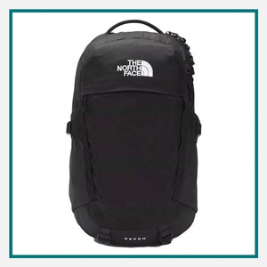 The North Face Recon Backpack in black with a top carry handle, multiple zippered compartments, side compression straps, and The North Face logo on the front.