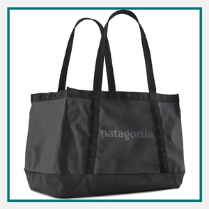 Black Patagonia Black Hole tote bag with dual handles and front pocket, displayed on white background with teal border frame