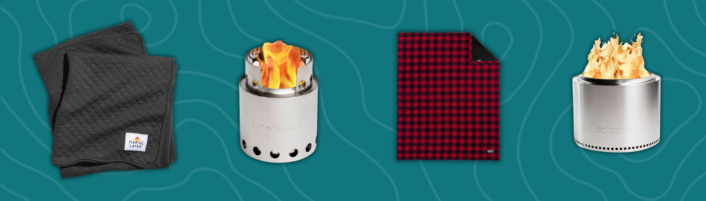 Cozy gift items including Eddie Bauer and Marine Layer blankets alongside Solo Stove Bonfire and Lite portable camp stoves on a teal background.