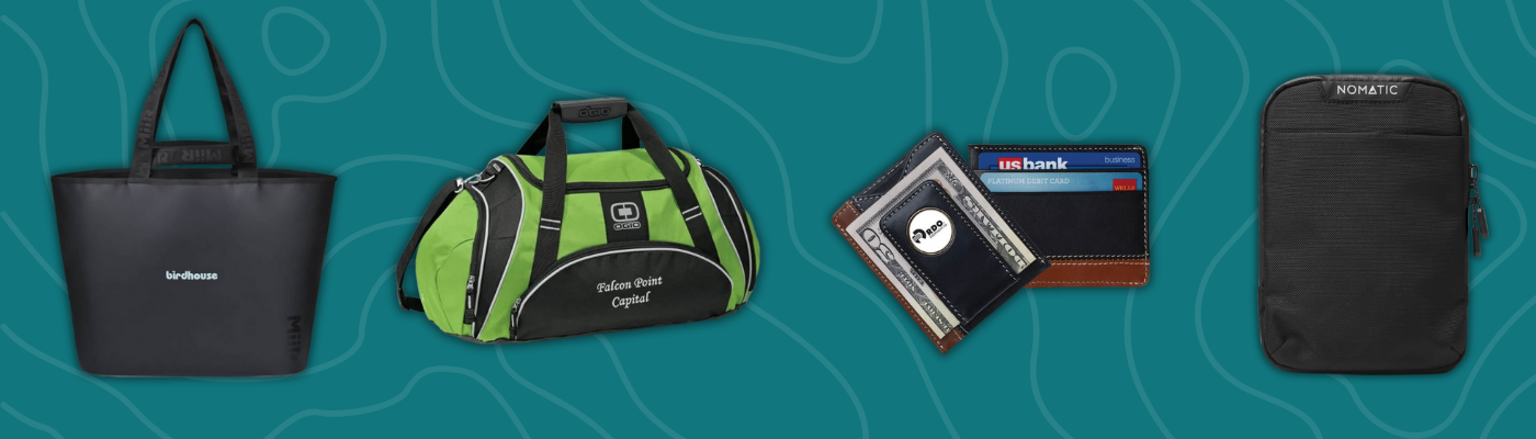 Corporate Christmas gifts including MiiR Bahia XL tote, OGIO duffel bag, NOMATIC access pouch, and two-tone leather magnetic wallet.