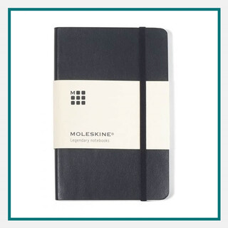 Black Moleskine notebook with an elastic band closure, wrapped in a cream-colored paper band labeled 