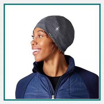 Woman wearing a Smartwool Merino Sport 150 Beanie in dark gray.
