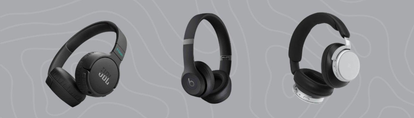 Three modern over-ear headphones in black and silver tones are displayed on a grey, patterned background.