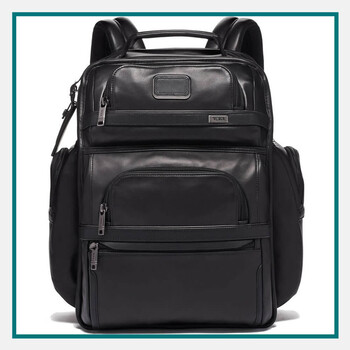 Black TUMI leather backpack with padded shoulder straps, top carry handle, and multiple zippered front pockets.